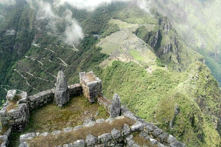 Inca stonework on the summit of Huayna Picchu above the citadel