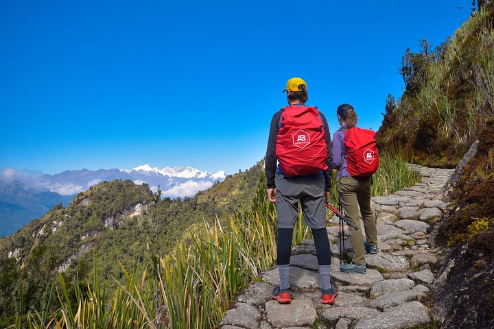 Two hikers on a stone section of the Inca Trail