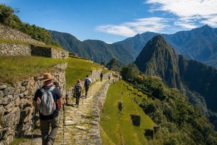 A hiker on the stone steps of the Inca Trail